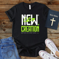 a black t - shirt with the words new creation printed on it
