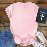 a pink t - shirt with a picture of a woman's face on it