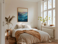 a bed sitting in a bedroom next to a window