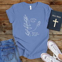 a t - shirt with the words made in the shape of a woman's