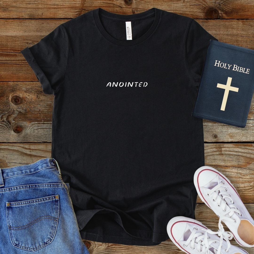 a black t - shirt with the words, holy bible, and a cross on