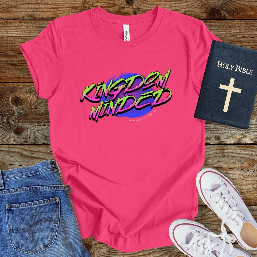 a pink t - shirt with the words kingdom minds printed on it
