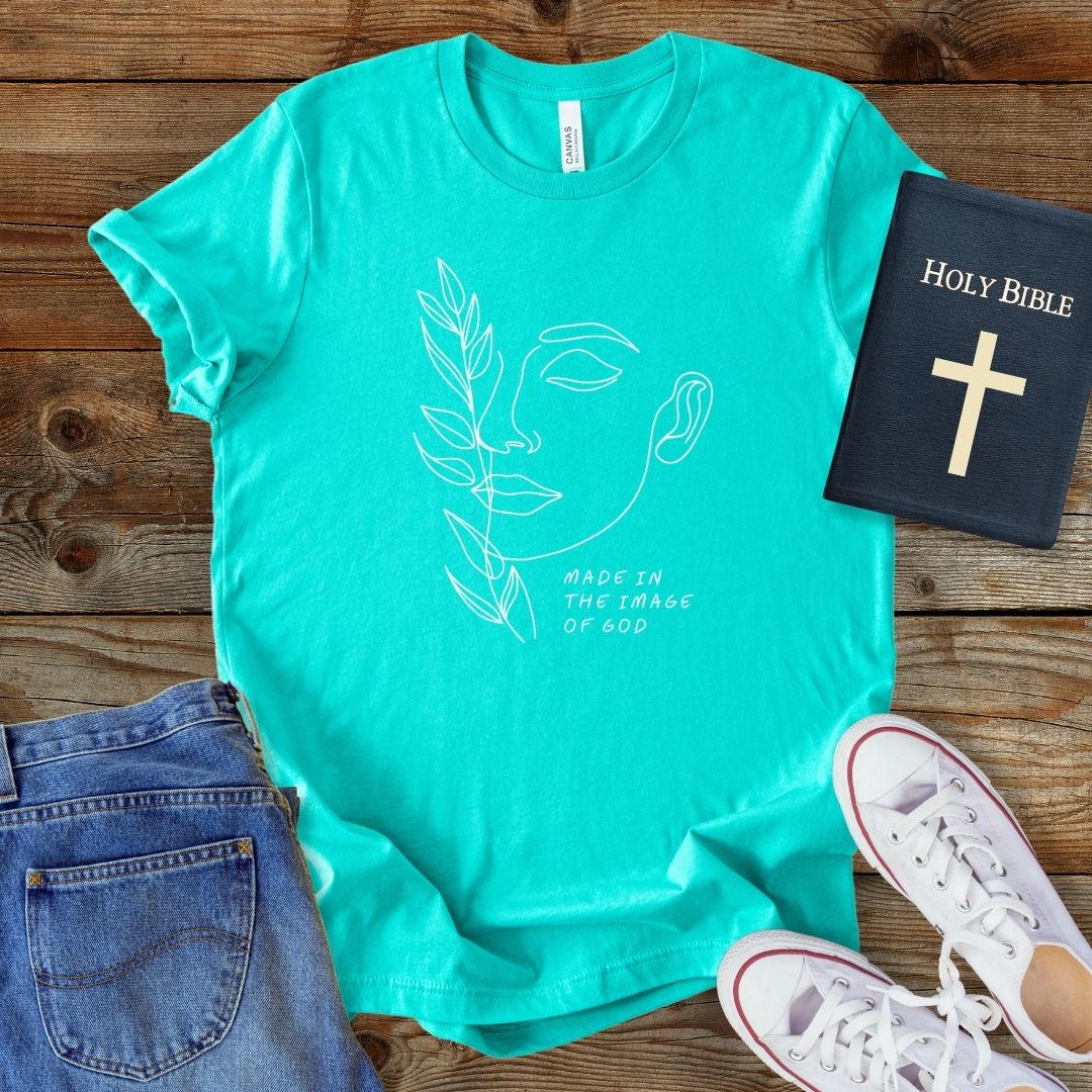a t - shirt with a bible and a pair of jeans