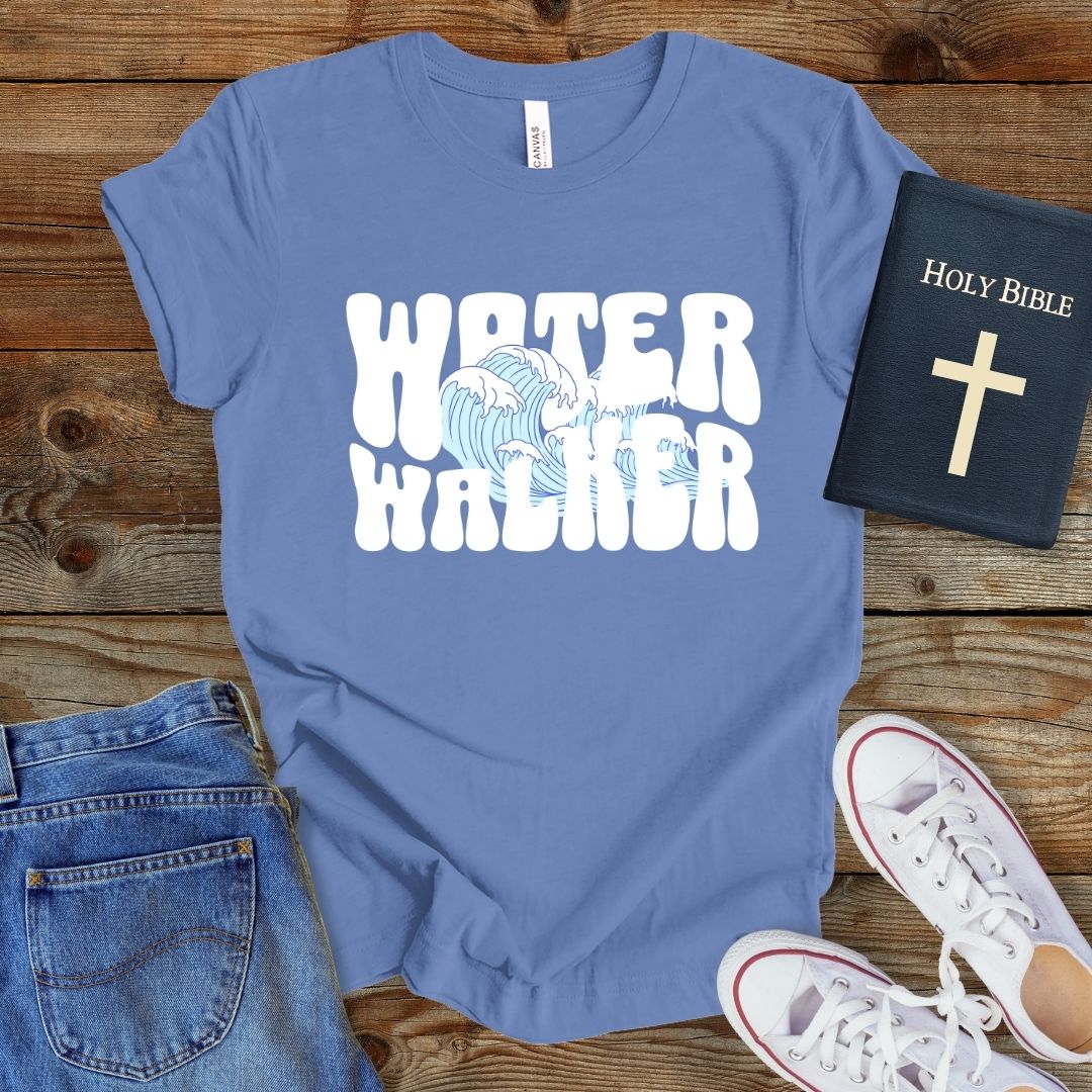 a t - shirt that says water warrior next to a bible