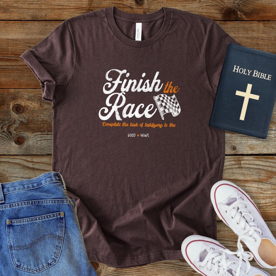 a t - shirt that says finish the race with a book and a pair of