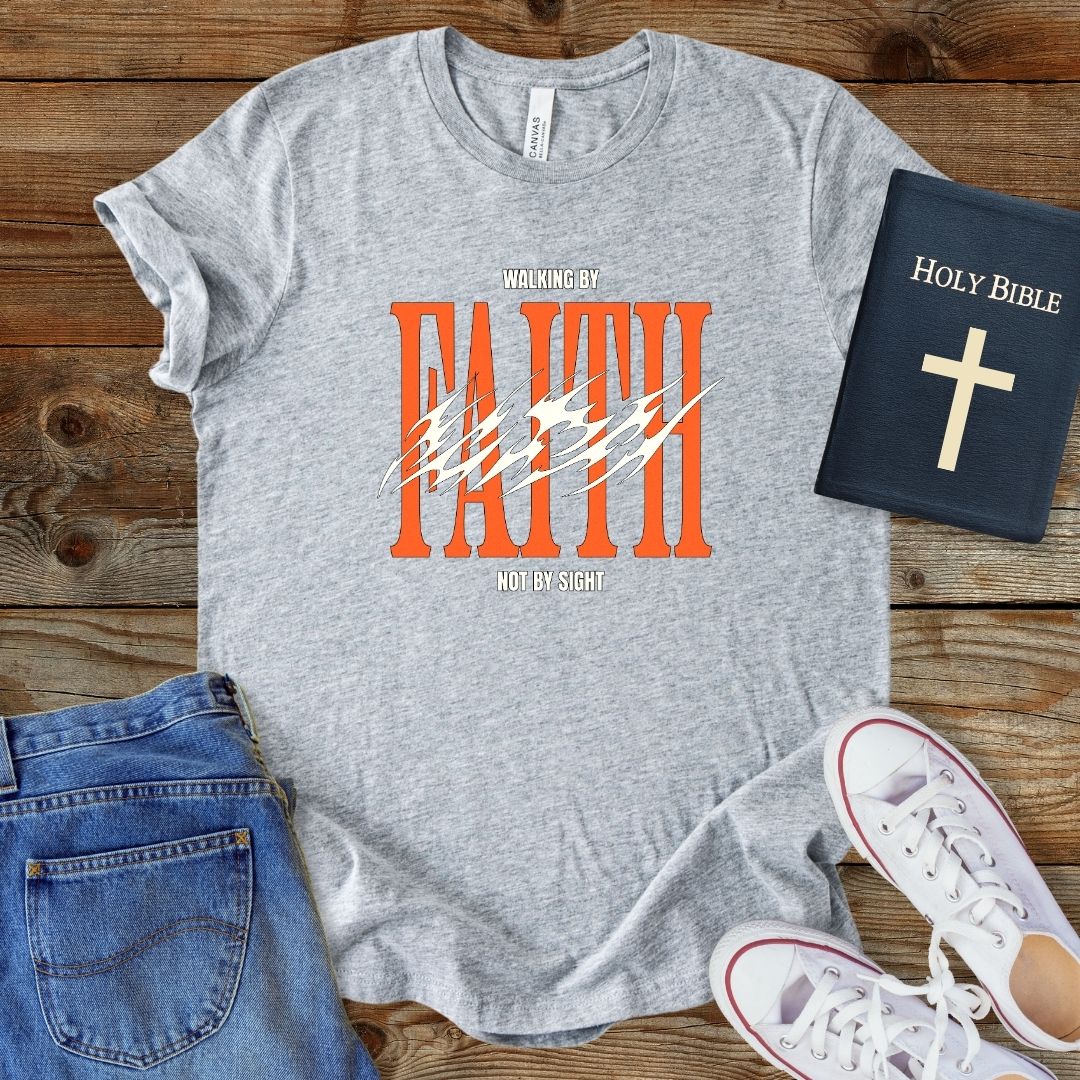 a t - shirt with the words faith and a bible next to it