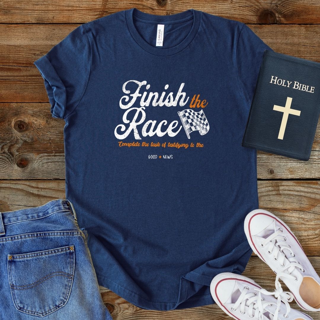 a t - shirt that says finish the race next to a pair of jeans
