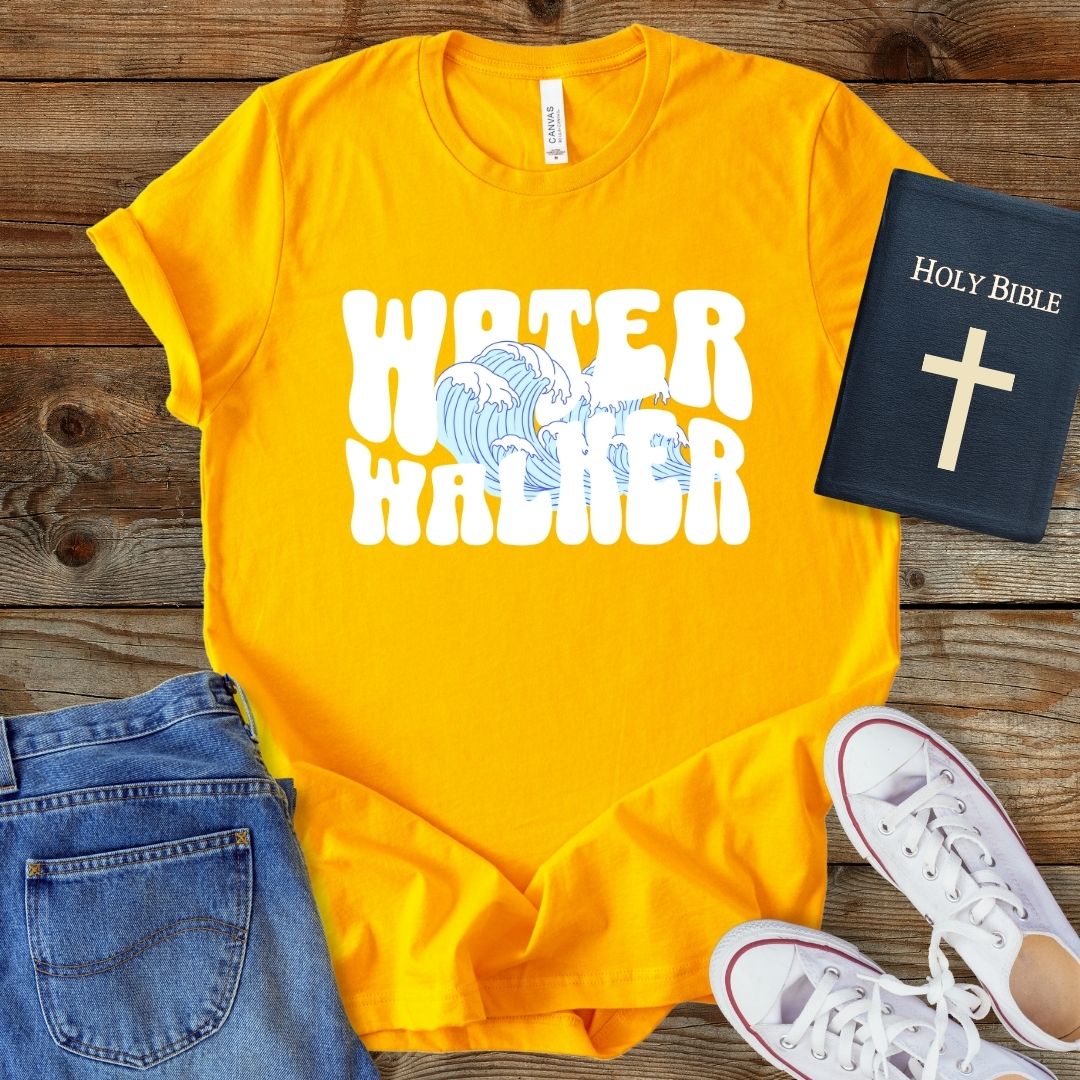 a t - shirt that says water warrior next to a bible