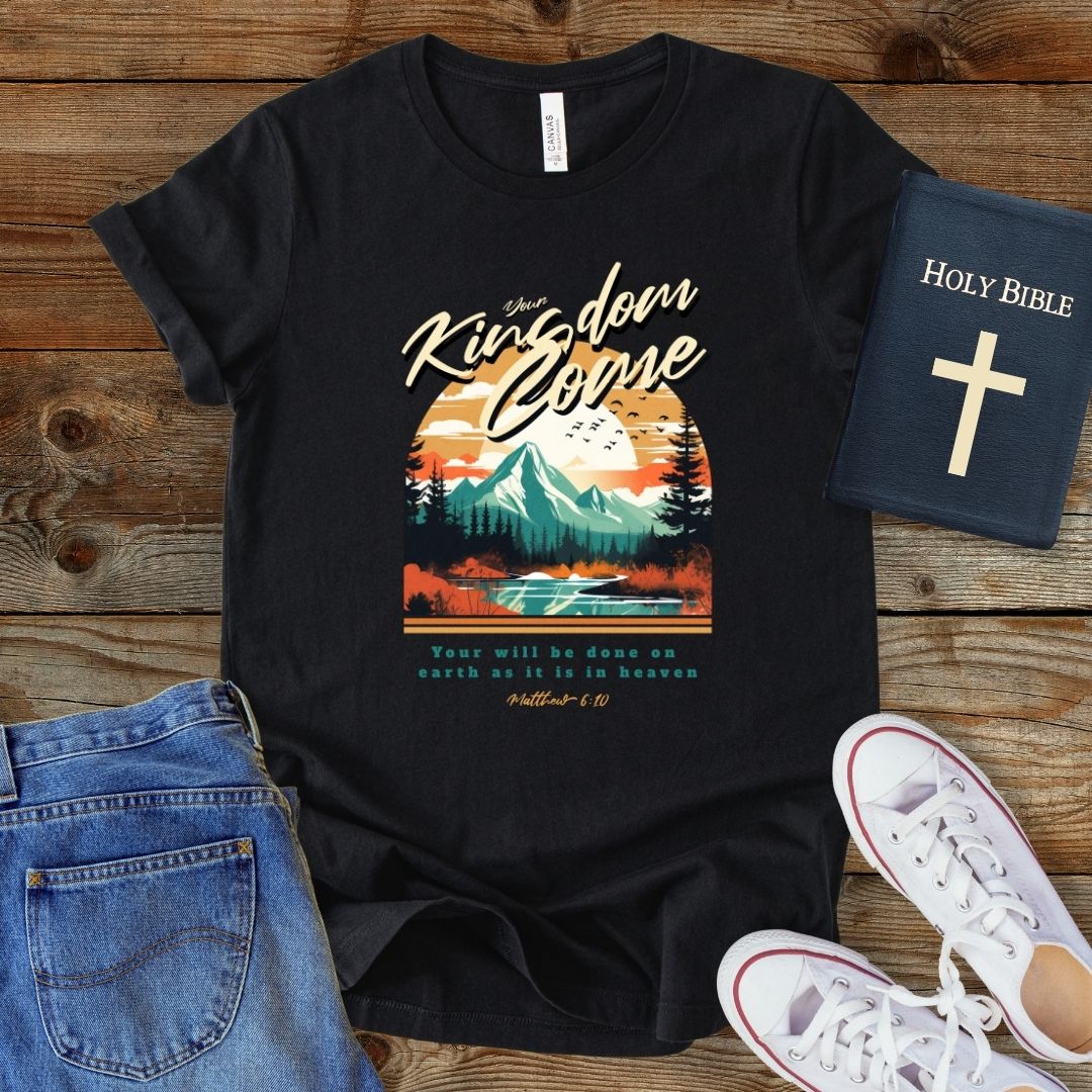 a black t - shirt with a mountain scene on it