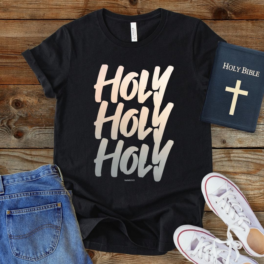 a t - shirt with the words holy and a bible next to it