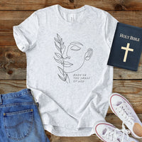 a t - shirt with a picture of a woman's face on it