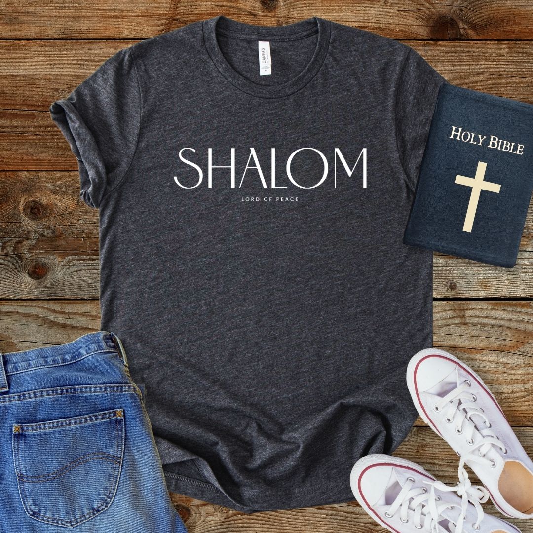 a t - shirt with the word shaiom on it next to a pair of