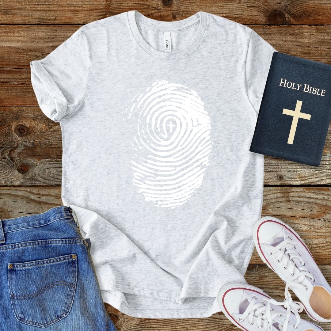 a t - shirt with a bible and a pair of jeans
