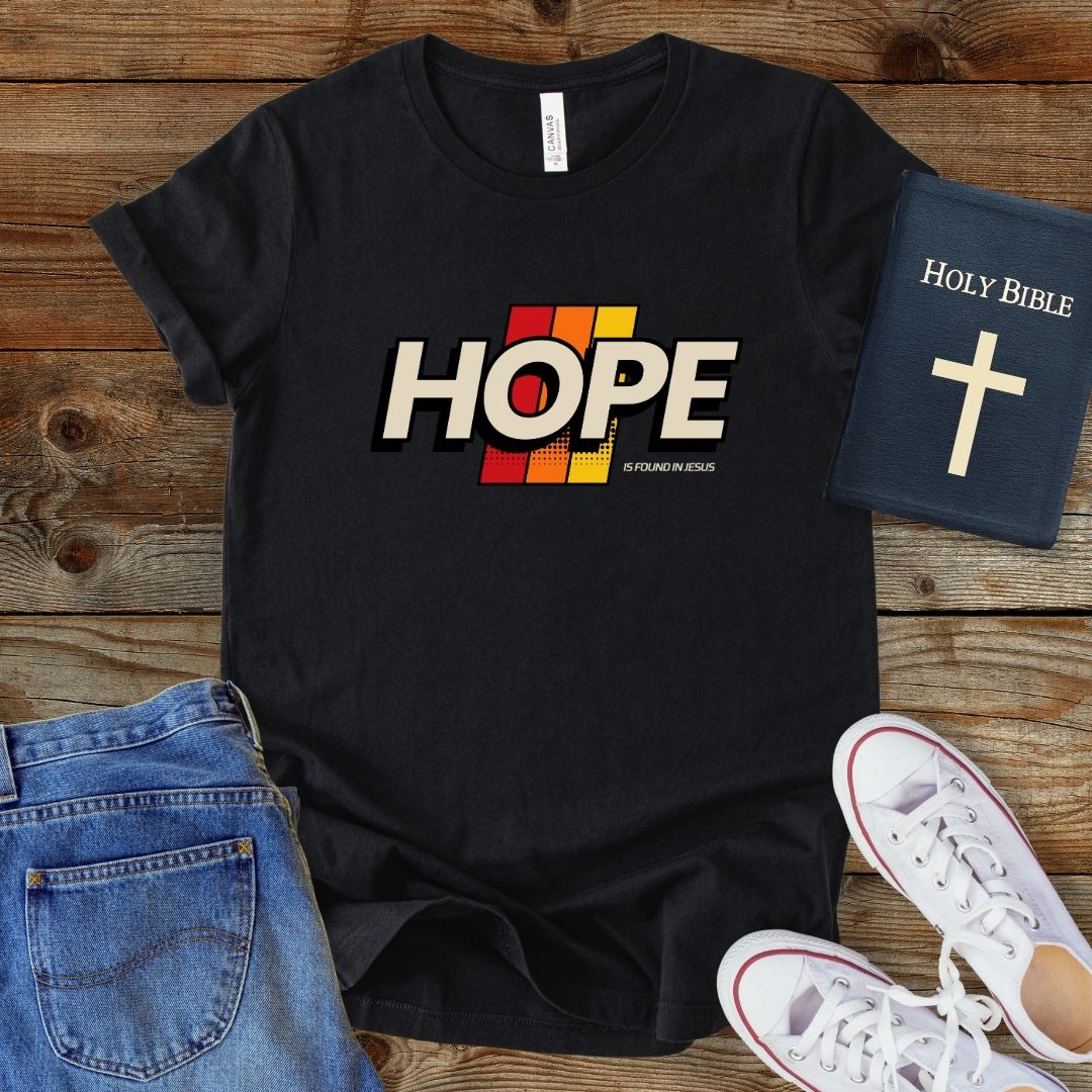 a t - shirt with the word hope on it next to a pair of jeans