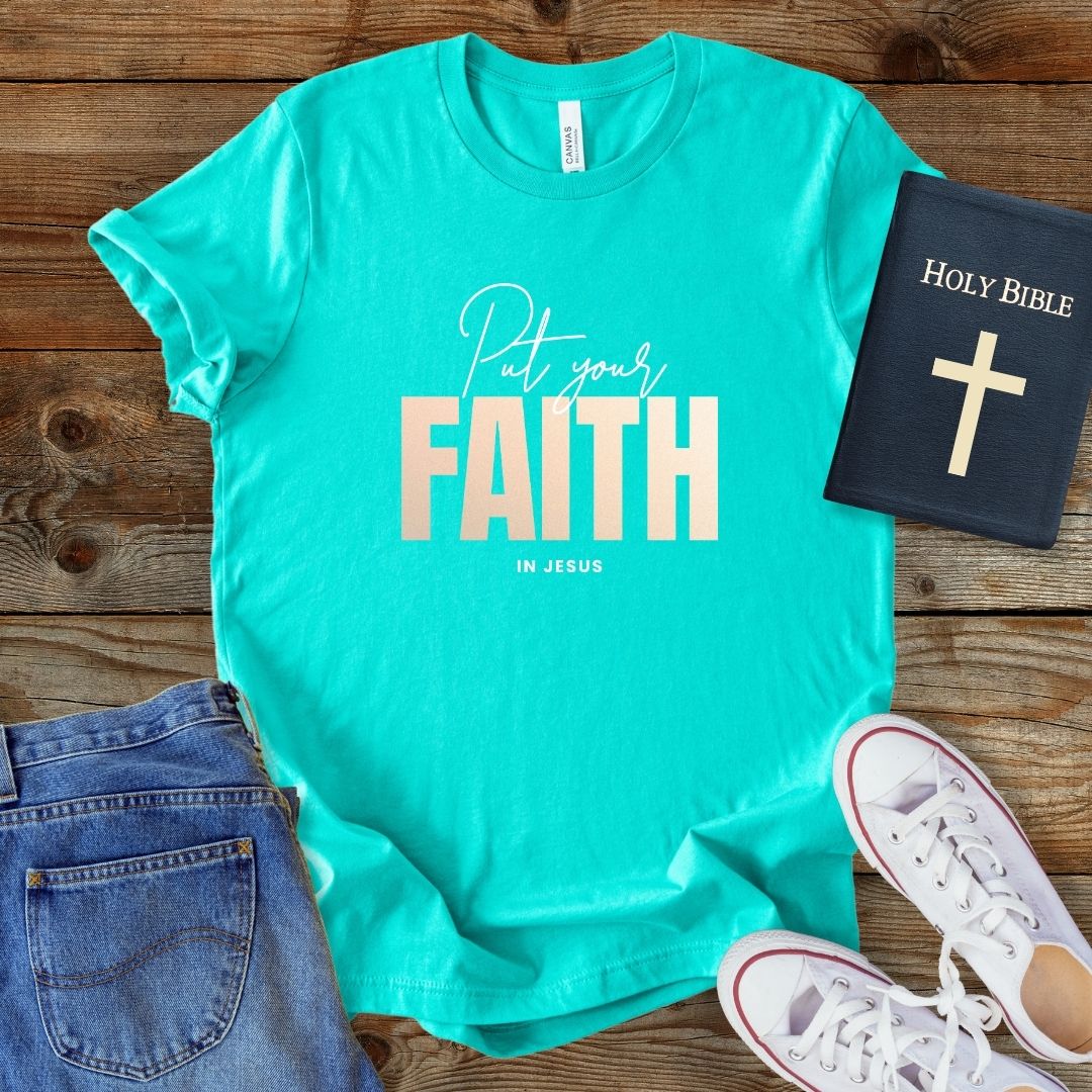 a t - shirt with a bible and a pair of jeans