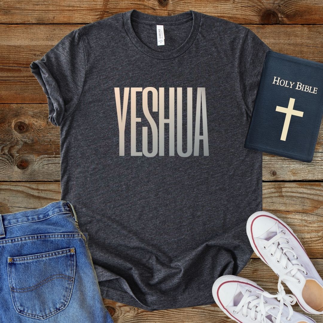 a t - shirt that says yeshuaa next to a bible