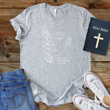 a t - shirt with a bible and a pair of jeans