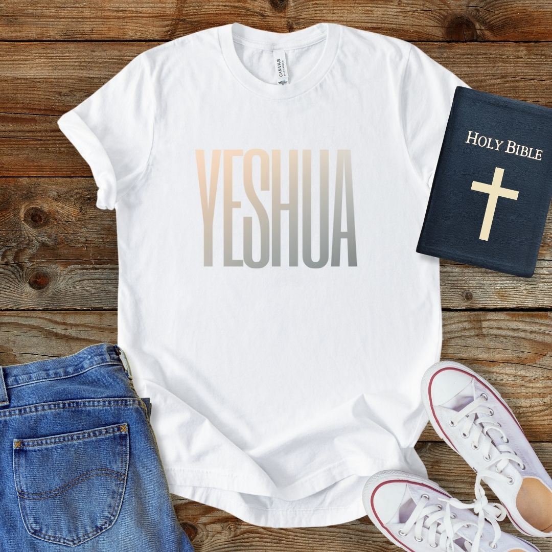 a t - shirt that says yeshuaa next to a bible